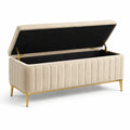 Banc de rangement en velours beige avec structure métallique et pieds dorés 120 cm
